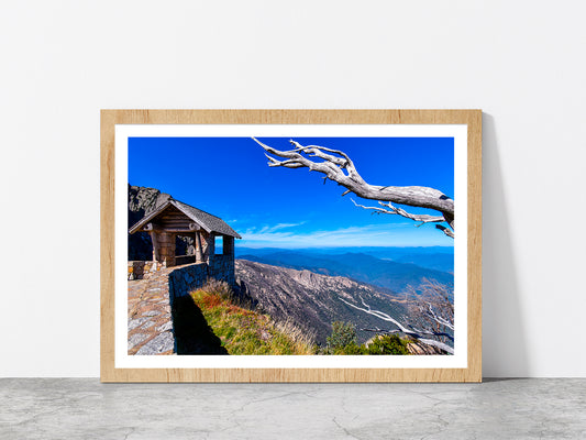 Hut On Top Of Mountain Blue Sky Glass Framed Wall Art, Ready to Hang Quality Print With White Border Oak