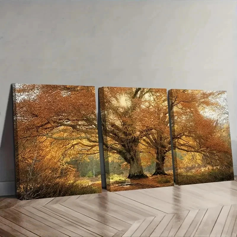 Three-panel canvas print of a forest scene with autumn trees on a wall.