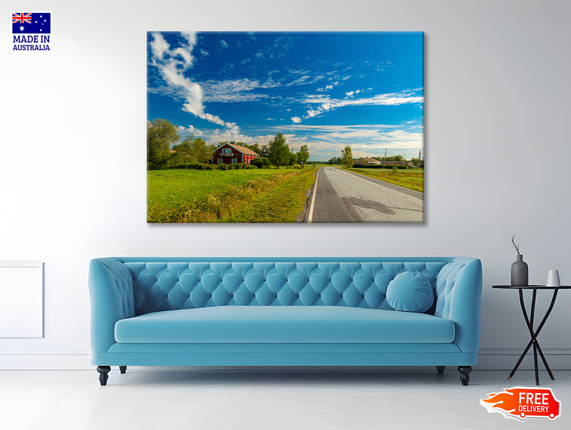 A Rural Road with Grass and Trees under a Cloudy Sky Print 100% Australian Made