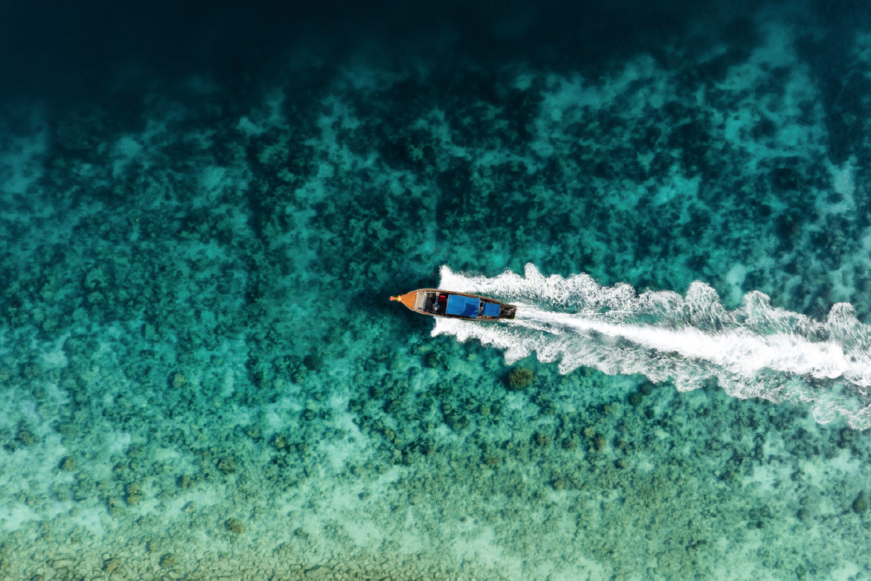 Aerial View of a Long tail Boat Sailing on a Water Print 100% Australian Made