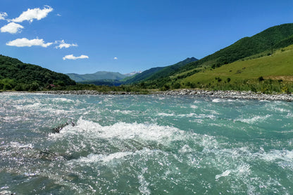 A River Flowing Through Green Hills with Mountains Print 100% Australian Made