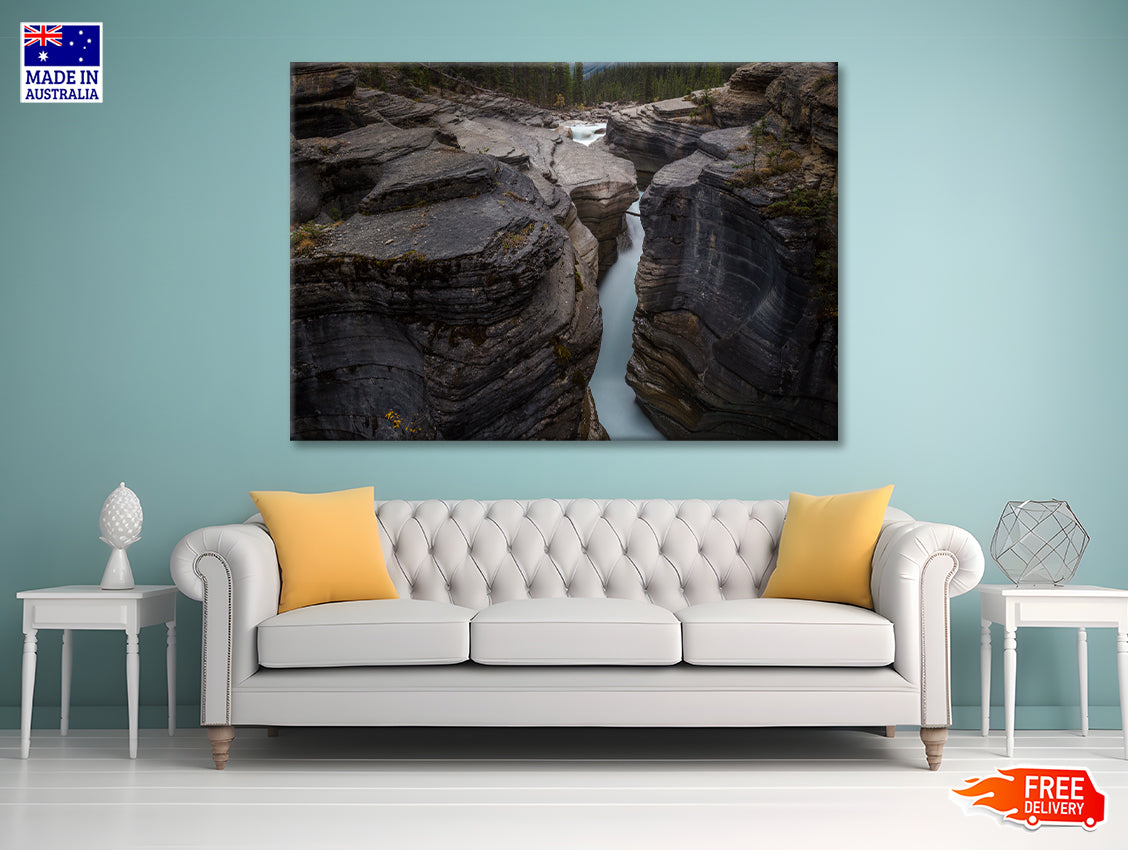 A River Flows through Cascading Over a Rocky Cliff Print 100% Australian Made