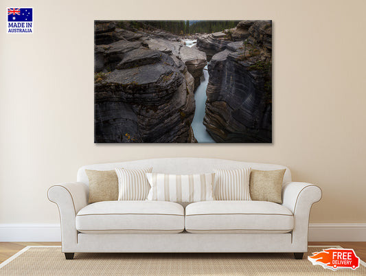 A River Flows through Cascading Over a Rocky Cliff Print 100% Australian Made