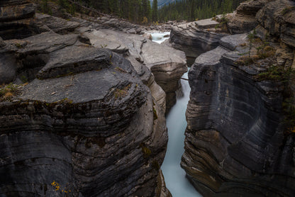 A River Flows through Cascading Over a Rocky Cliff Print 100% Australian Made