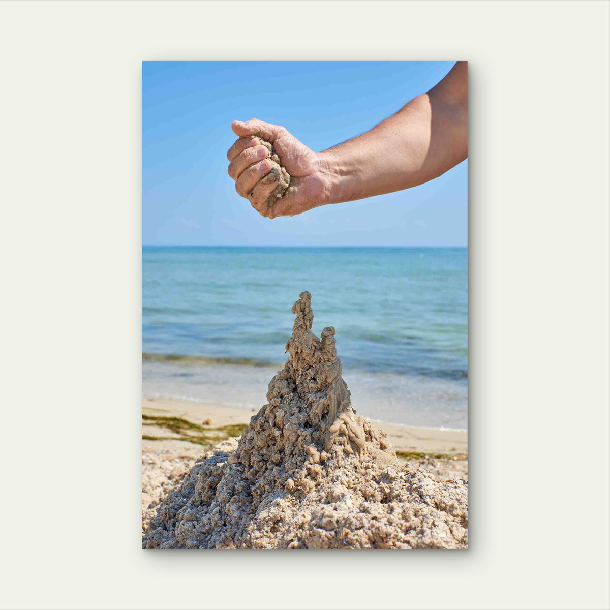 Hand Builds A Castle From The Wet Sea Sand Metal Print Ready to Hang