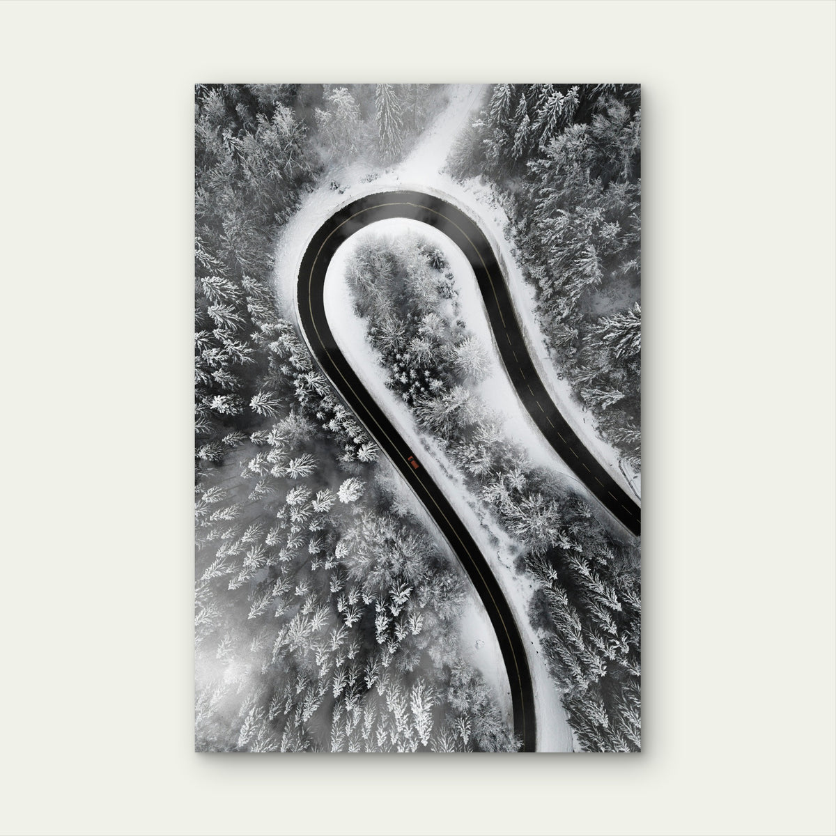 Aerial View of Car on Snow-Covered Winding Road 40x60cm Metal Print Ready to Hang
