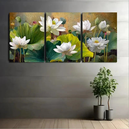 Three-panel canvas print of white flowers with green leaves on a gray wall.