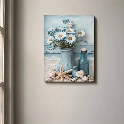 Canvas print of a beach scene with flowers, bottles, and starfish on a beige wall.