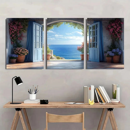 Three-panel wall art depicting a scenic view of the ocean with a desk and chair in front.