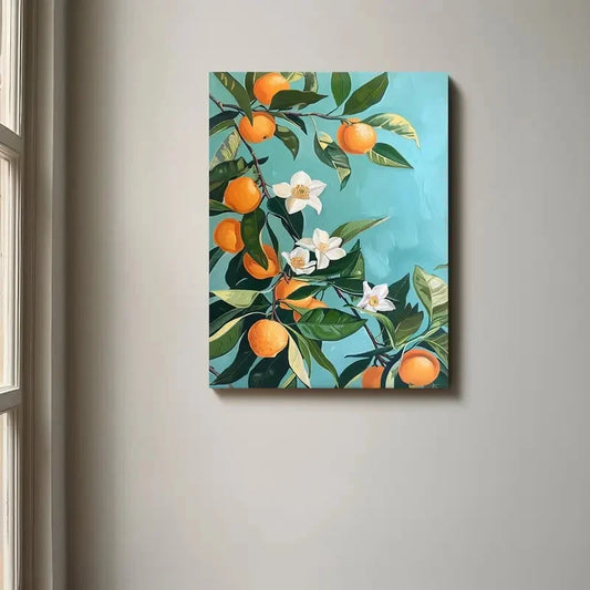 Canvas print of oranges and flowers on a teal background, hanging on a wall.