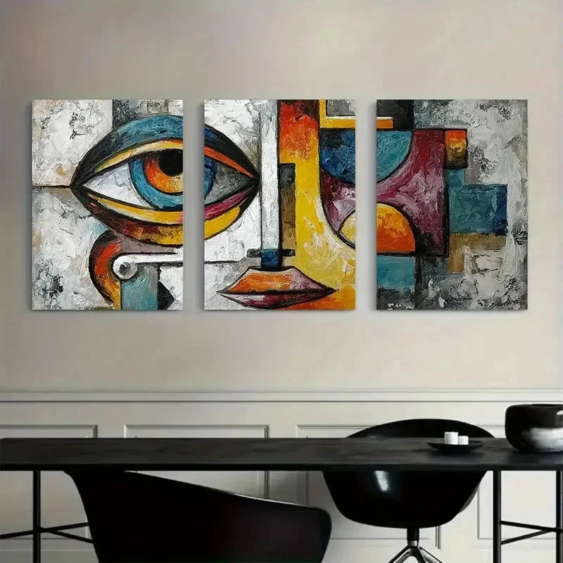 Abstract art piece on a wall above a dining table with chairs.