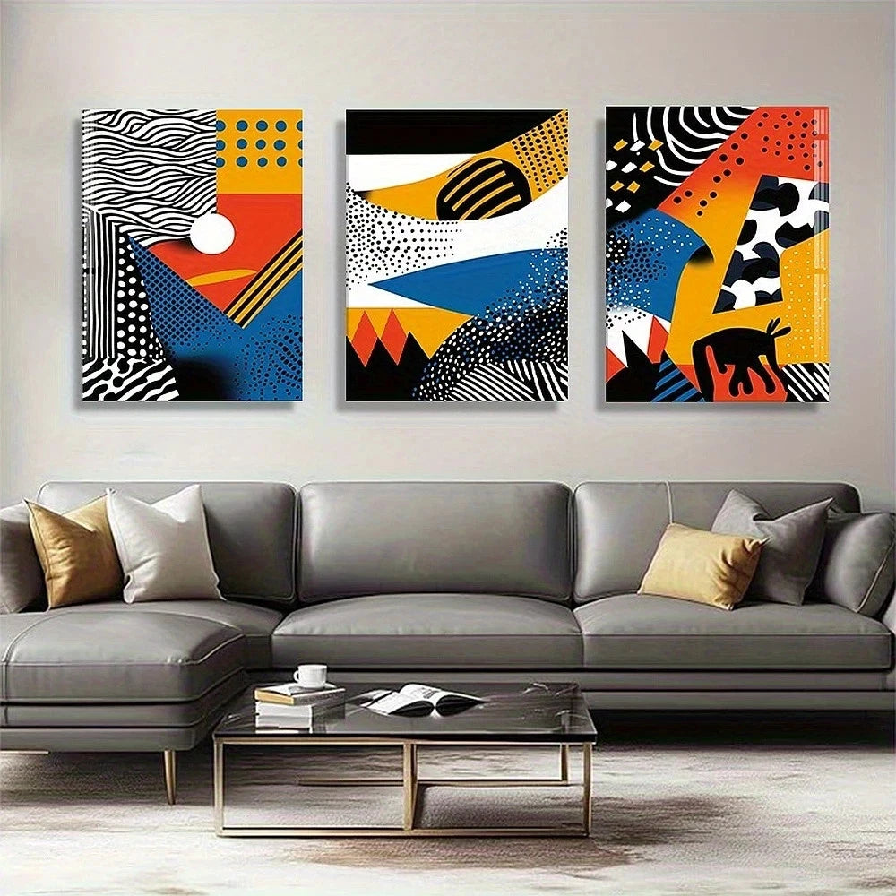 Three abstract art pieces above a gray sofa in a living room setting.