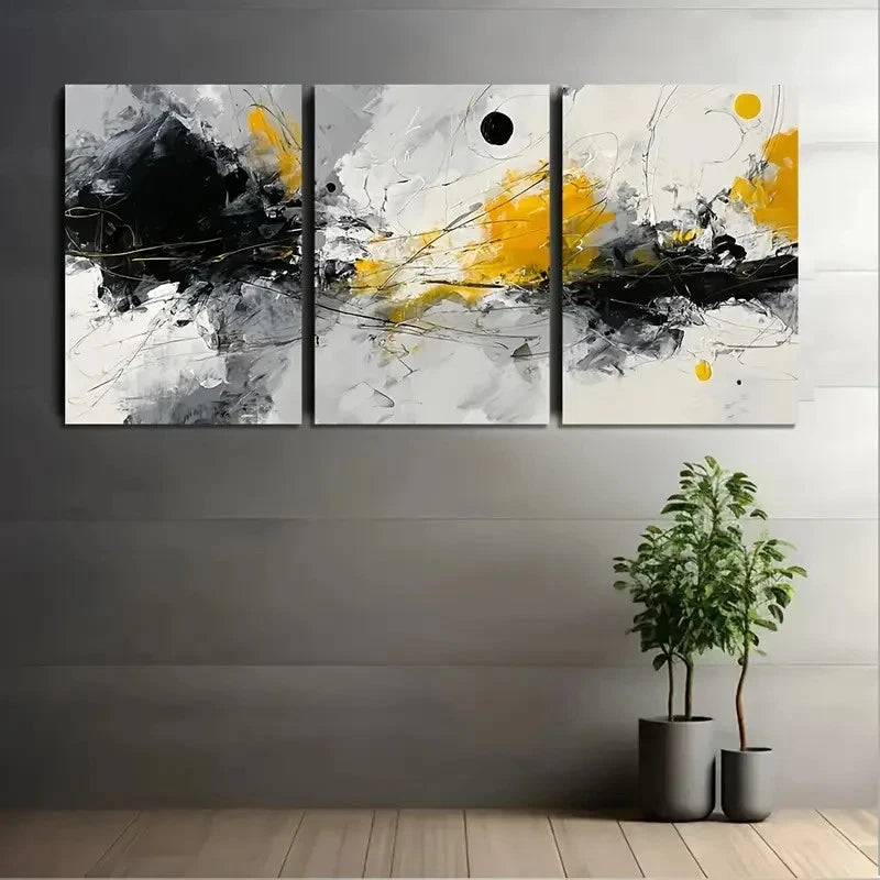 Abstract art triptych with black, yellow, and gray on a wall with two potted plants below.