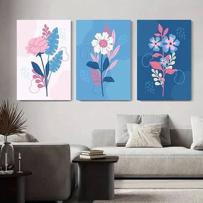 Three floral wall art pieces on a wall above a sofa in a living room.