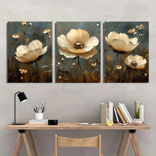 Three floral paintings above a desk with office supplies.