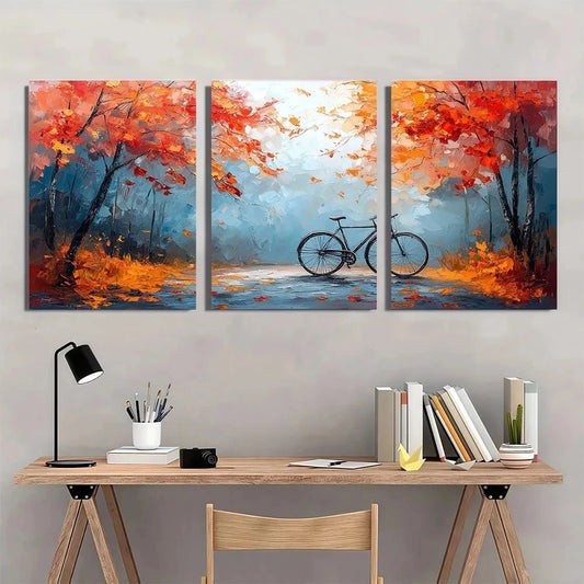 Three-panel abstract painting of a cyclist in an autumnal setting above a desk.