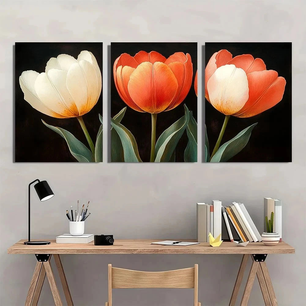 Three-panel wall art of tulips above a desk with books and a lamp.