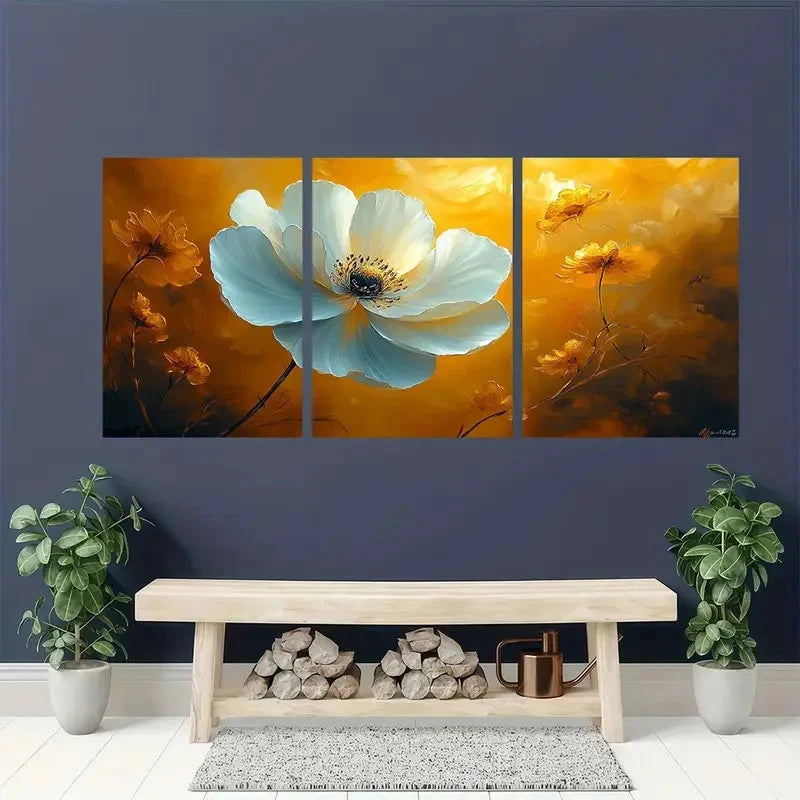 Triptych floral artwork on a wall above a wooden bench with decorative items.
