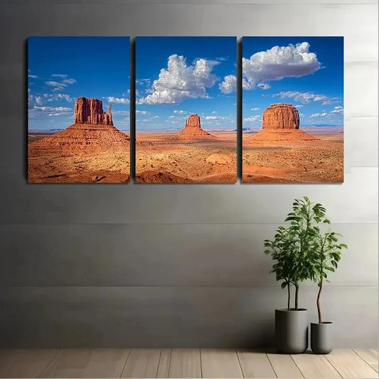 Three-panel canvas print of a desert landscape with rock formations on a gray wall.
