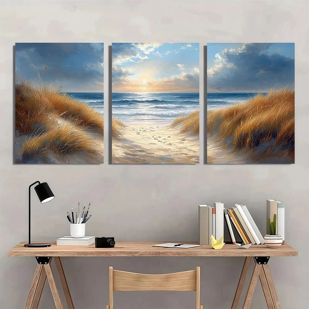 Three-panel wall art of a beach scene above a wooden desk with office supplies.