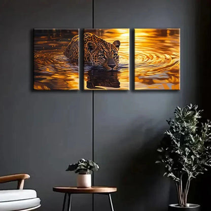 Three-panel canvas print of a leopard in water on a dark wall with a chair and plants below.