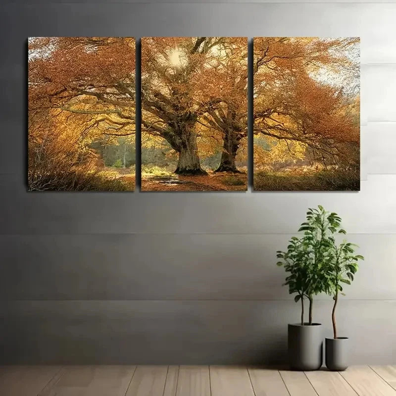 Three-panel canvas print of a tree with autumn foliage on a gray wall.