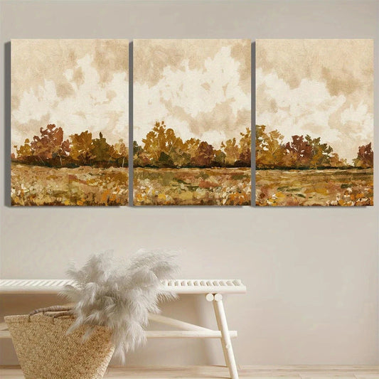Three-panel wall art depicting a landscape with trees and clouds, mounted on a wall above a white bench.