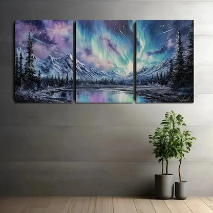 Three-panel canvas art of a mountain landscape with a starry sky, displayed on a wall.
