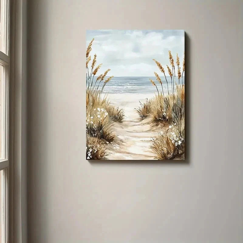 Canvas print of a beach scene with a path and tall grasses, hanging on a wall.