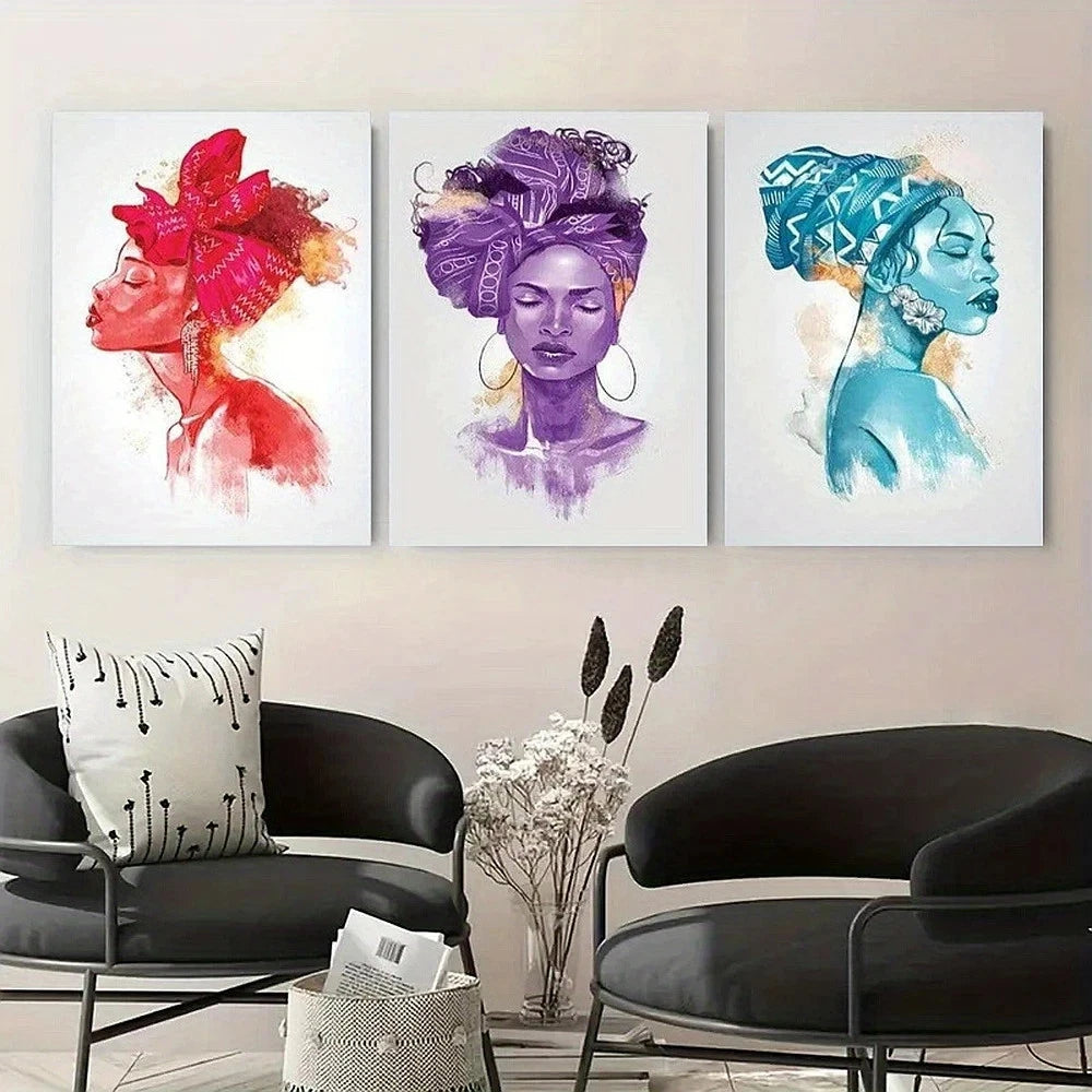 Three colorful portraits of women with headwraps hanging on a wall above modern black chairs.
