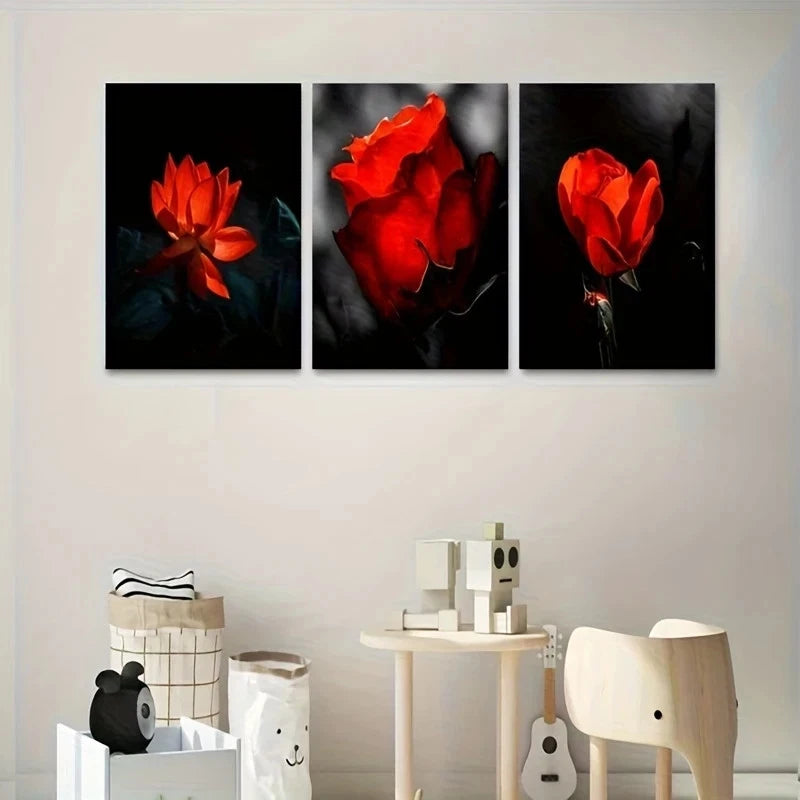 Three red flower paintings on a wall above a child's room with toys and furniture.