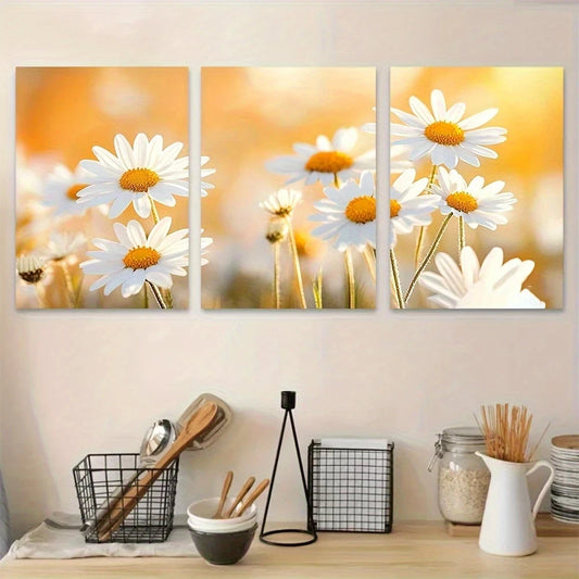 Three-panel wall art of daisies on a neutral wall above a kitchen counter.