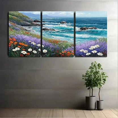 Triptych painting of a coastal scene with flowers on a wall above two potted plants.