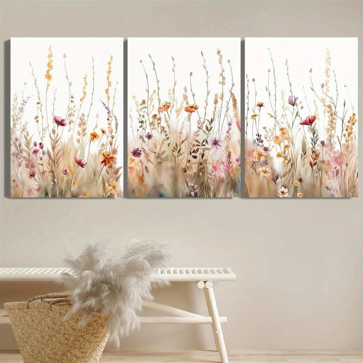 Three-panel wall art of floral design on a white wall with a decorative chair and basket in the foreground.
