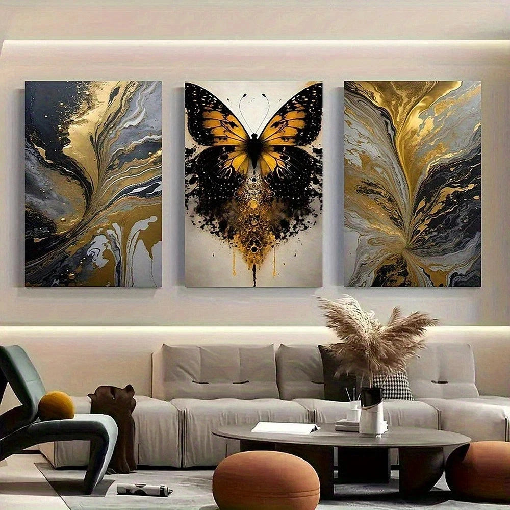 Three abstract butterfly paintings on a wall above a sofa in a living room.