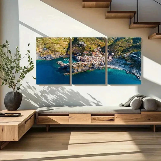 Modern living room with a large wall art depicting a coastal scene.