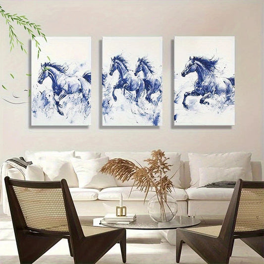 Three framed paintings of running horses on a wall above a sofa in a living room.