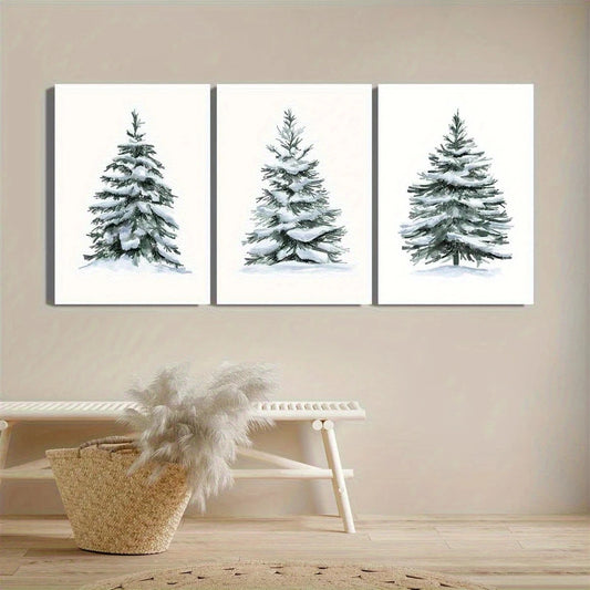 Three framed artworks of snow-covered trees on a beige wall above a white shelf with decorative items.