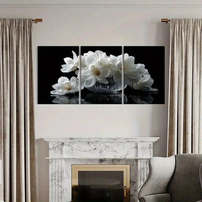 Multiframe wall art of white flowers above a fireplace with curtains and sofa.