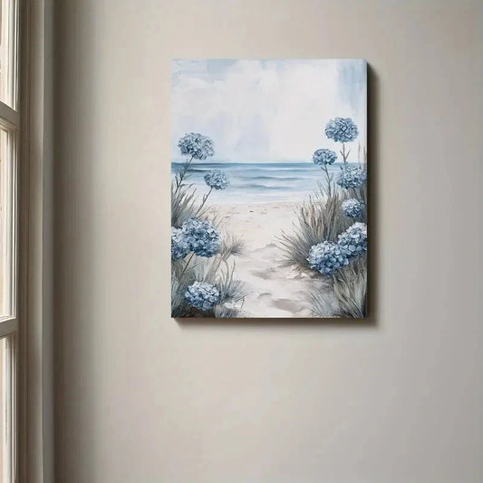 Canvas print of a beach scene with blue flowers hanging on a wall.