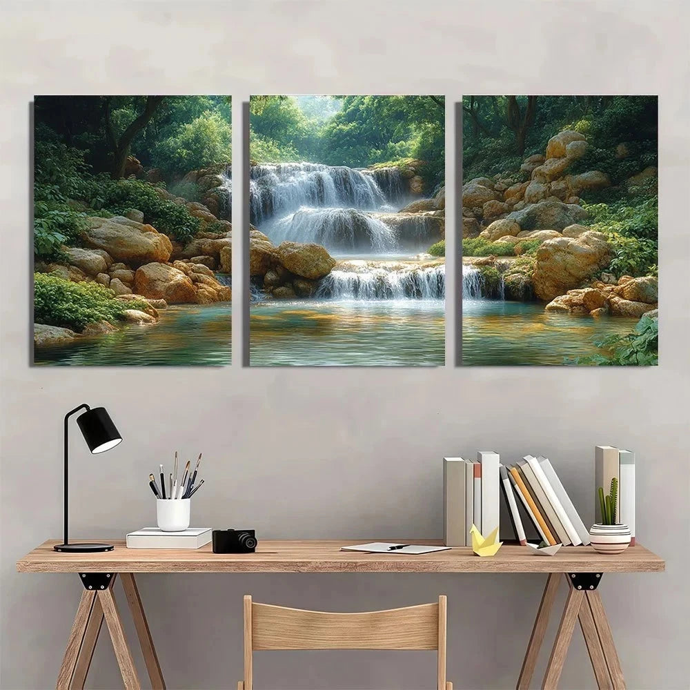 Three-panel wall art depicting a waterfall in a forest above a desk with stationery items.