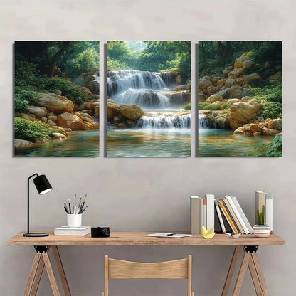 Three-panel wall art depicting a waterfall in a forest above a desk with stationery items.