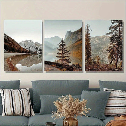 Three framed landscape paintings of mountains and trees above a sofa with decorative pillows and a vase.