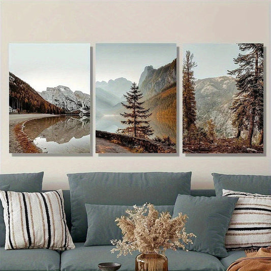 Three framed landscape paintings of mountains and trees above a sofa with decorative pillows and a vase.