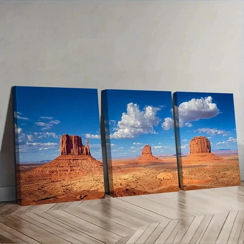 Triptych canvas print of a desert landscape with red rock formations and blue sky.