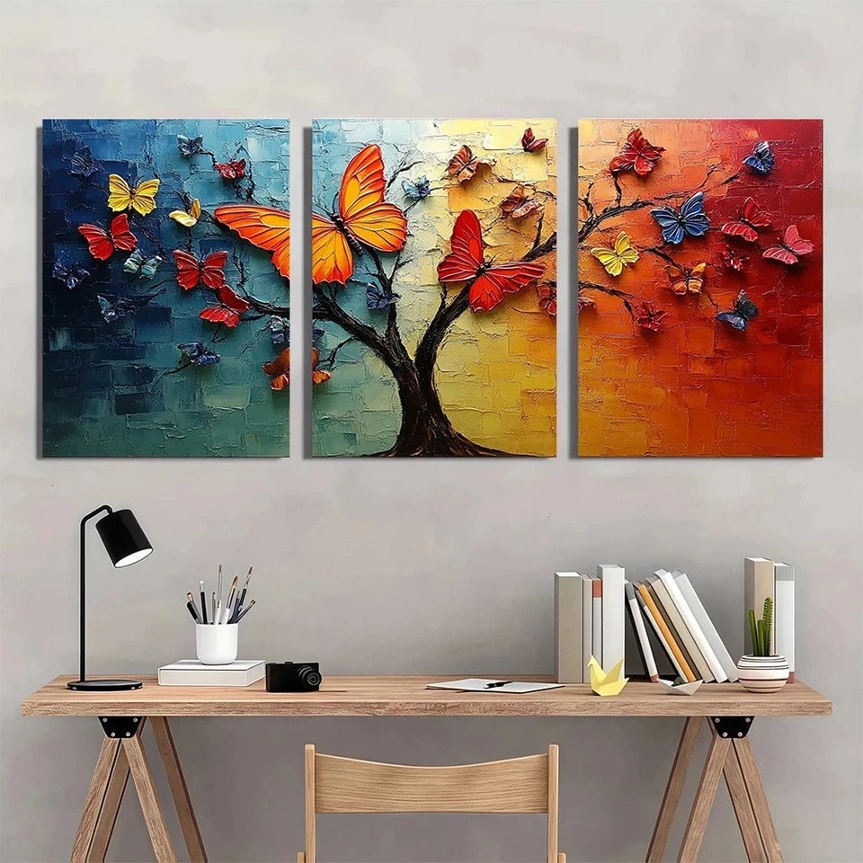 Three colorful butterfly artworks on a wall above a wooden desk with books and stationery.
