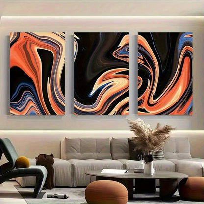 Three abstract wall art pieces on a wall above a sofa in a living room.