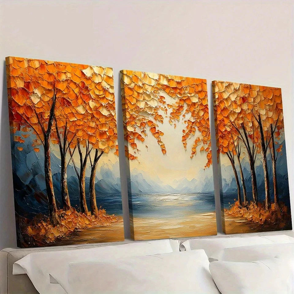 Three-panel painting of autumn trees by a lake on a wall.