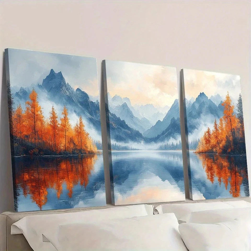 Three-panel wall art of a mountain landscape with trees and water.
