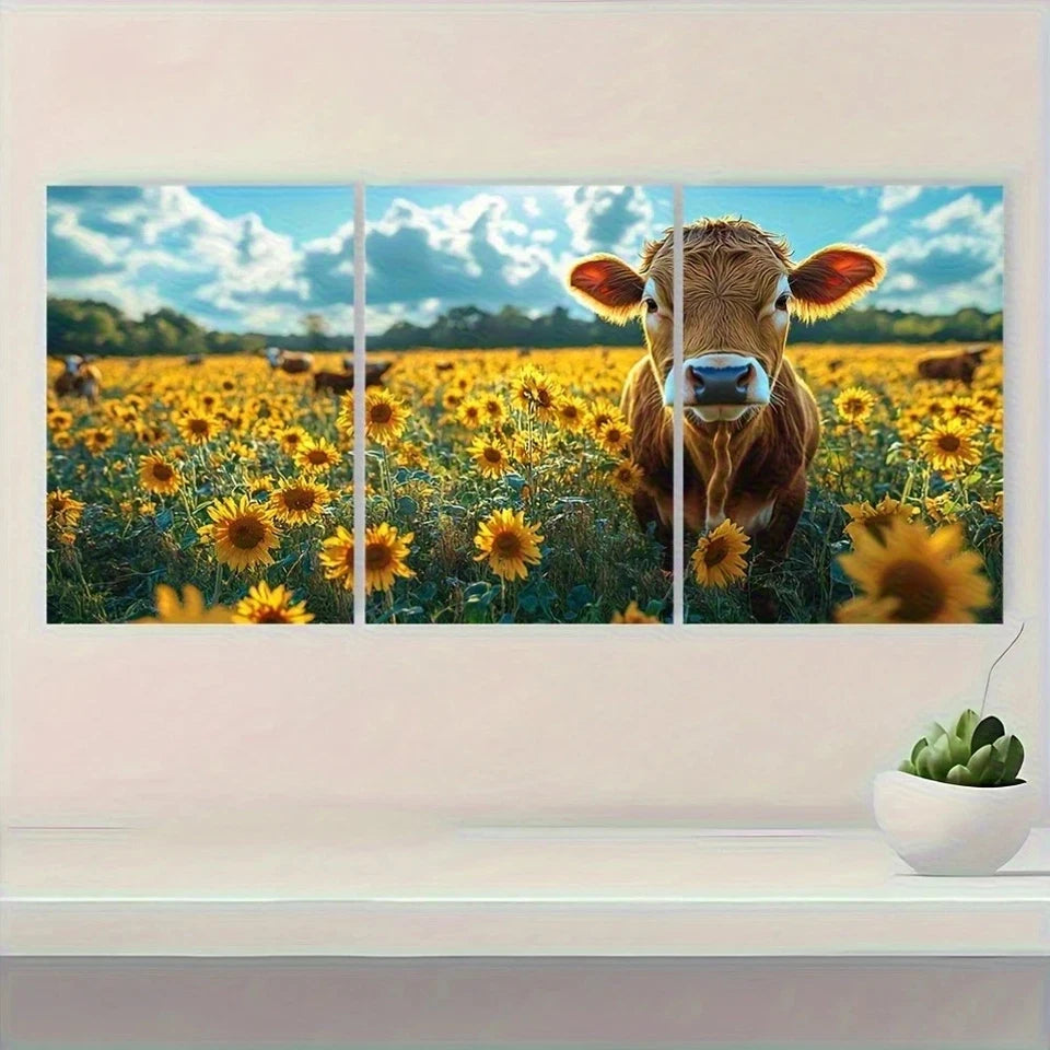Cow in a field of sunflowers with a decorative frame on a wall.